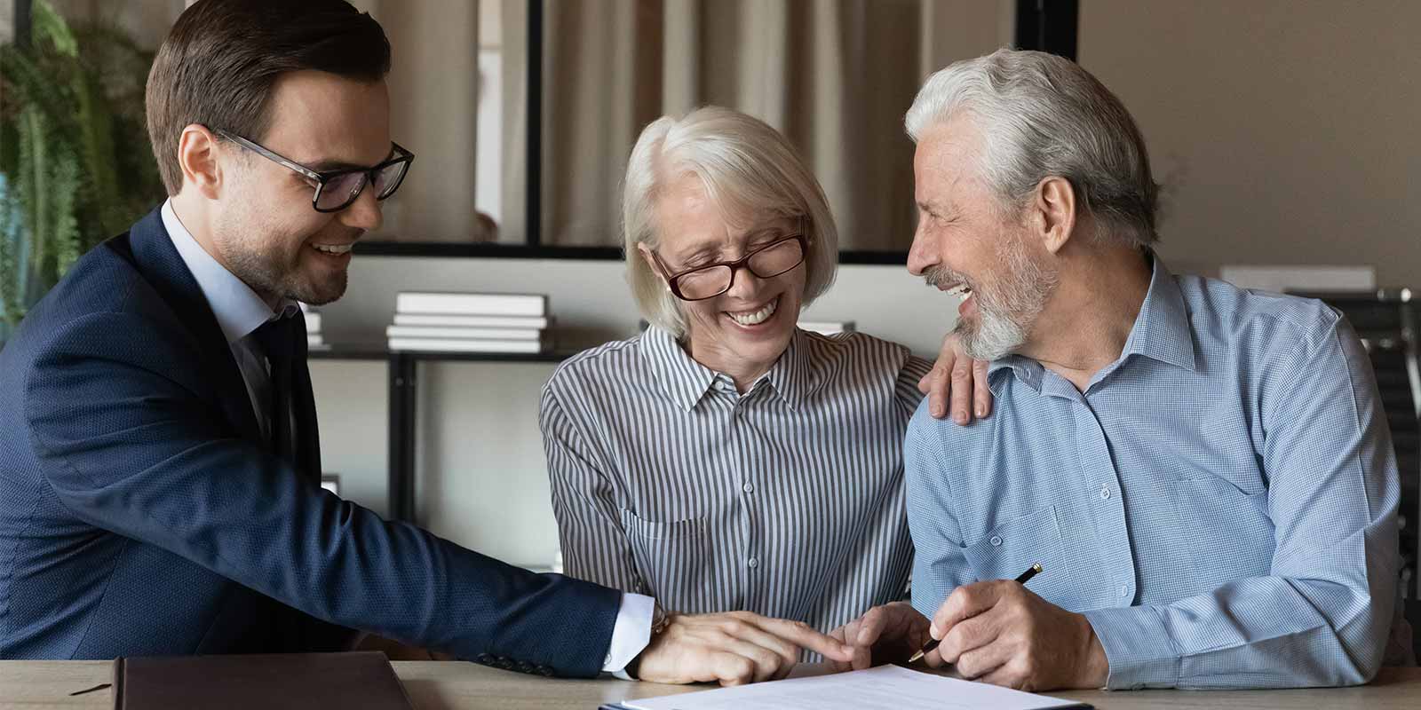 insurance agent helping couple with their irr insurance policy