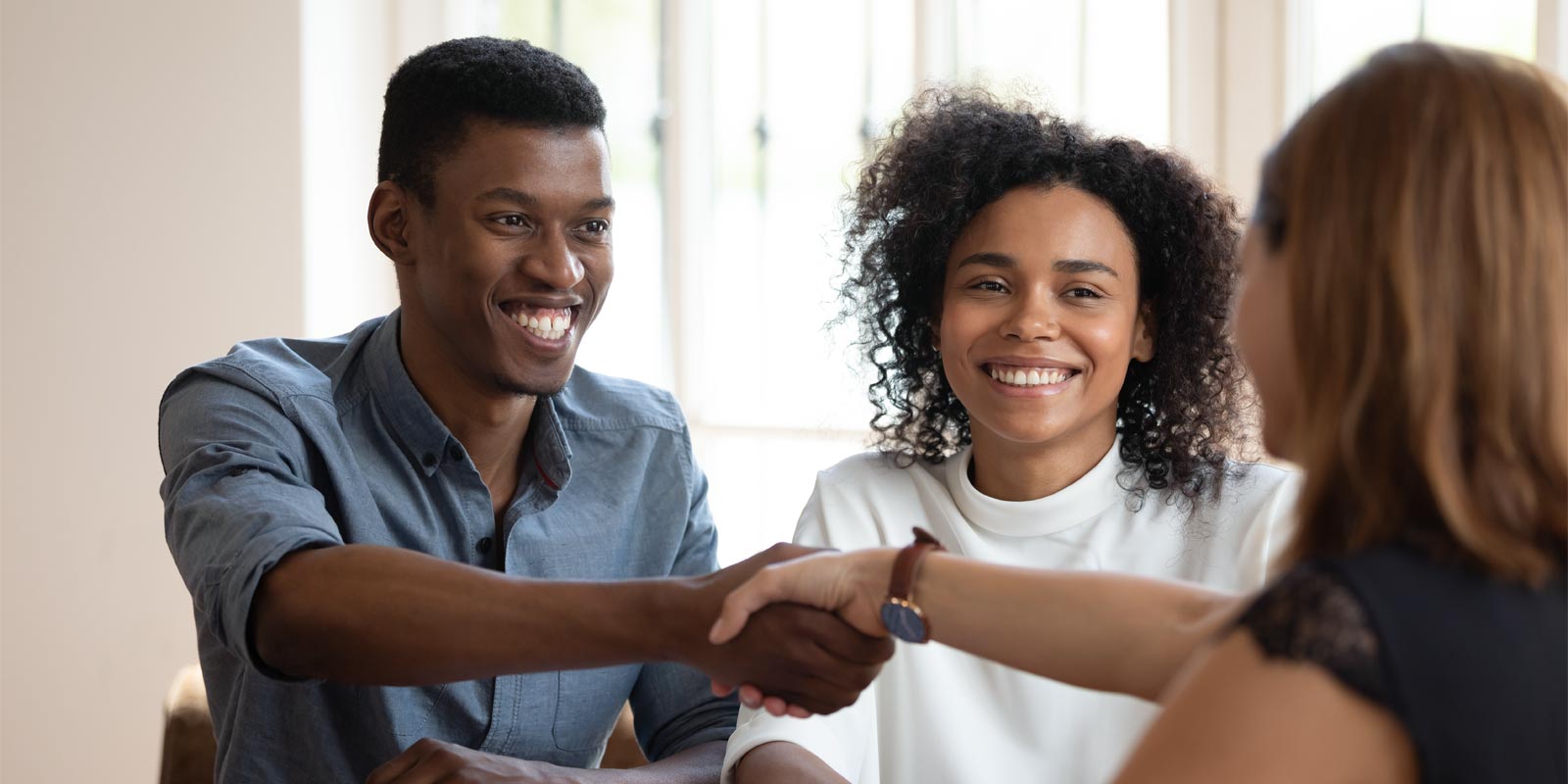 a couple meeting with a life insurance consultant to discuss life insurance benefits