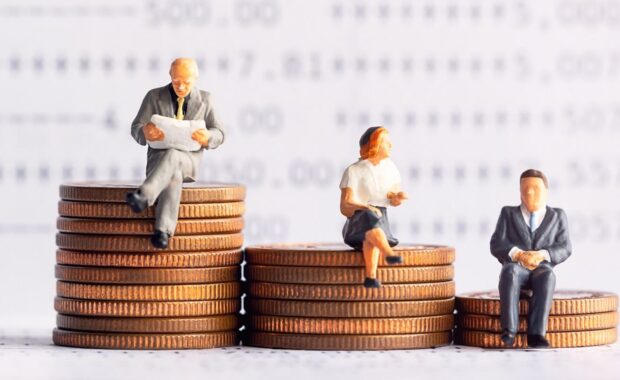 people sitting on coins stack