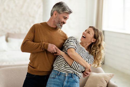 Couple Dancing In Their Living Room