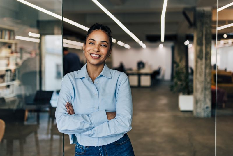 Business Owner Standing In The Doorway Of Her Office