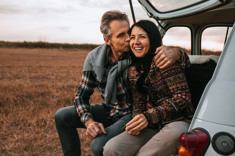 Couple Hanging Out In The Back Of Their Car