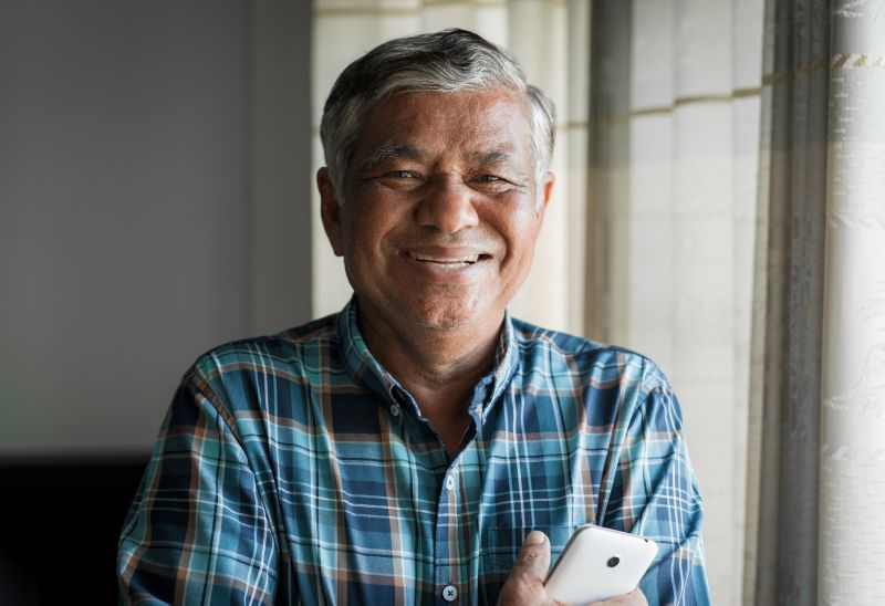 Gentleman Smiling Holding Phone