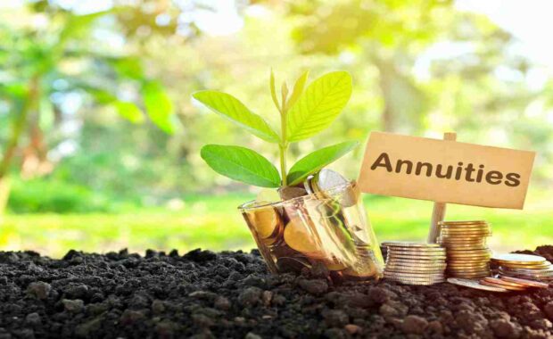 Coins in A Jar with Soil and Growing Plant Showing Annuities Concept