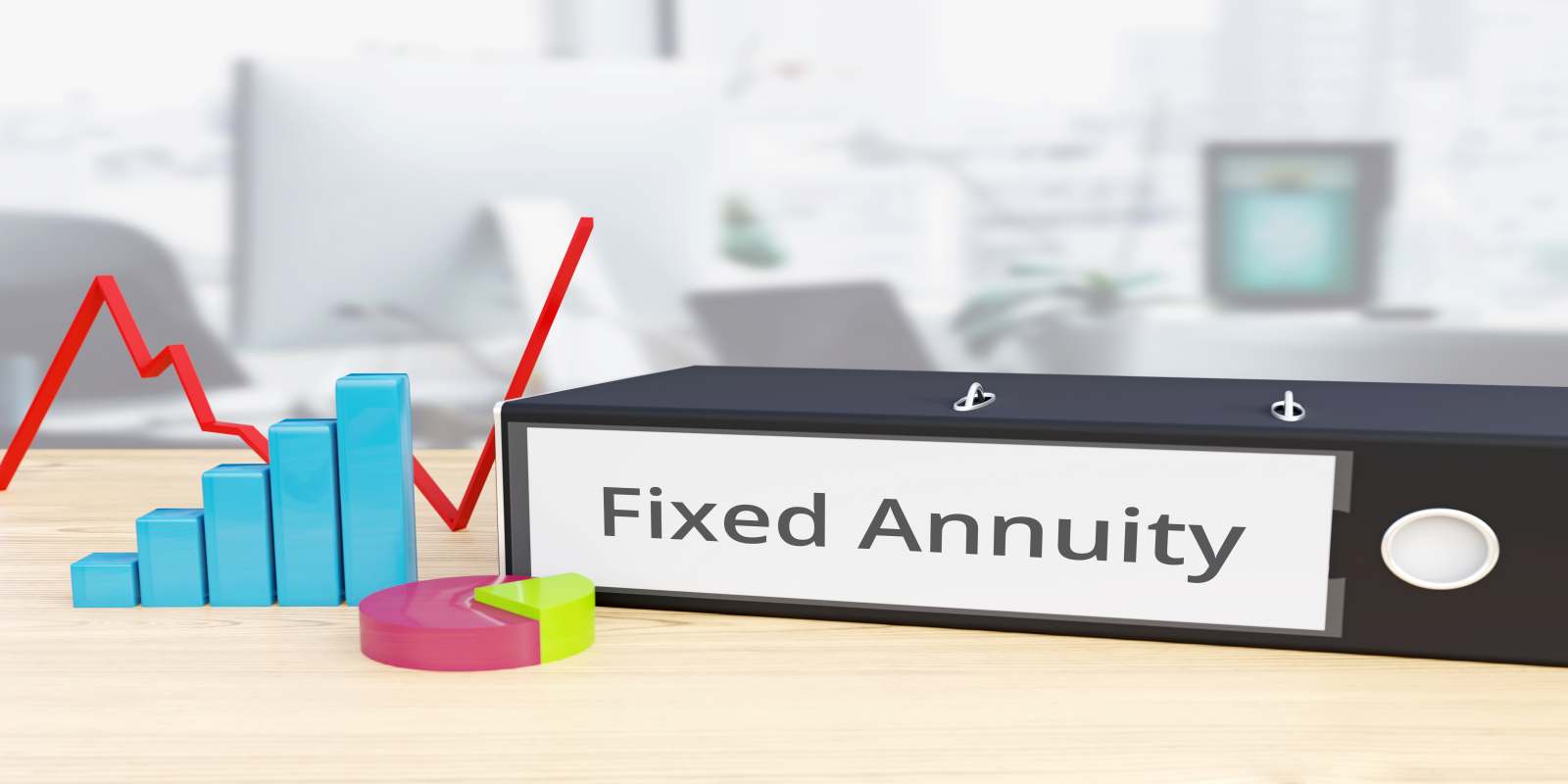 Folder on Desk with Fixed Annuity Label Besides Financial Diagrams