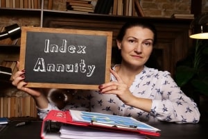 Woman Holding Chalkboard with Text Index Annuity in North Carolina offic