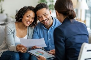 Happy Couple Meeting with A Consultant to Discuss Retirement Planning