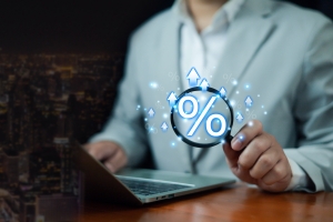 Percentage Sign on Digital Magnifying Glass Showing Predictable Investment Growth
