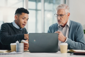 Senior Man Talking to Financial Advisor for Adding Fixed Annuity to His Retirement Plan