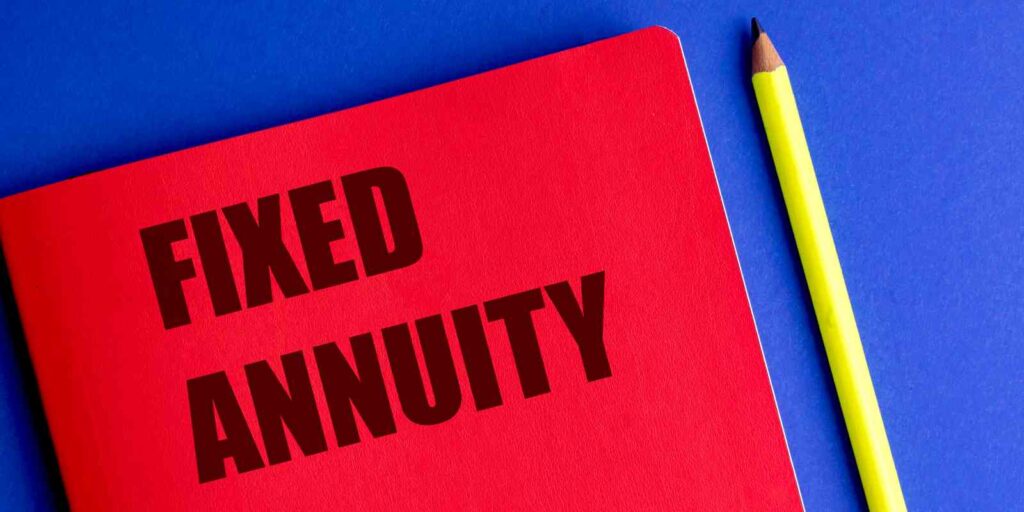 Red Notebook with Text Fixed Annuity and Yellow Pencil