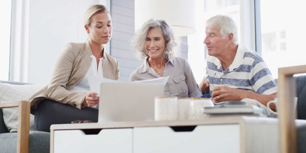 Finacial Advisor Showing Fixed Annuity Options to Senior Couple