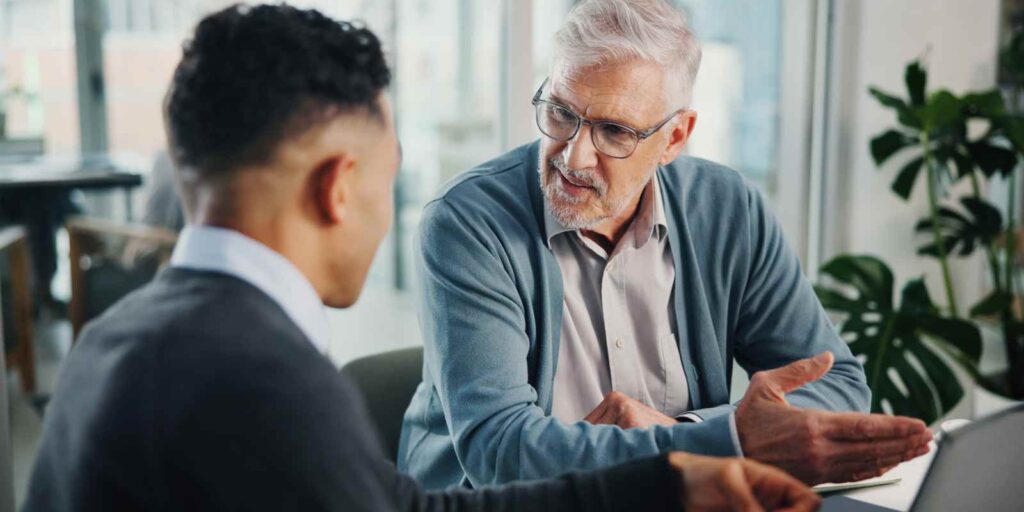 Senior Person Discussing MYGA Term for Retirement Timeline with Finacial Advisor