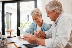 Senior Couple Checking MYGA Documents with Other Legacy Tools