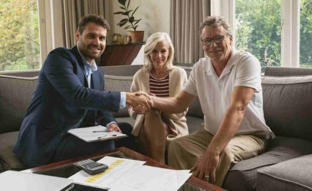 Senior Man Shaking Hand with Financial Advisor for Fixed Annuity Investment