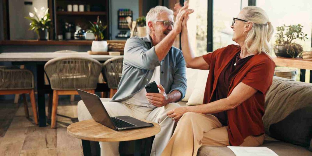 Pre-Retirees Giving High Five to Each Other after Evaluating A MYGA