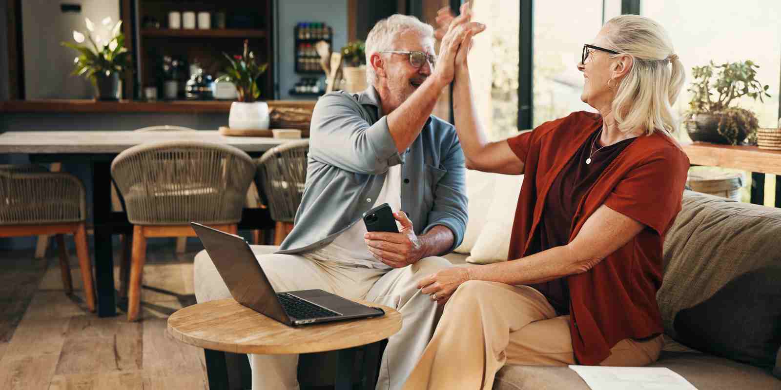 Pre-Retirees Giving High Five to Each Other after Evaluating A MYGA