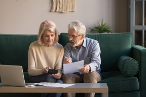 Senior Couple Calculating MYGA and Fixed Deposit Returns