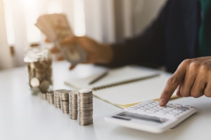 Strategic Retirement Planning Concept Represented Through Calculator and Money