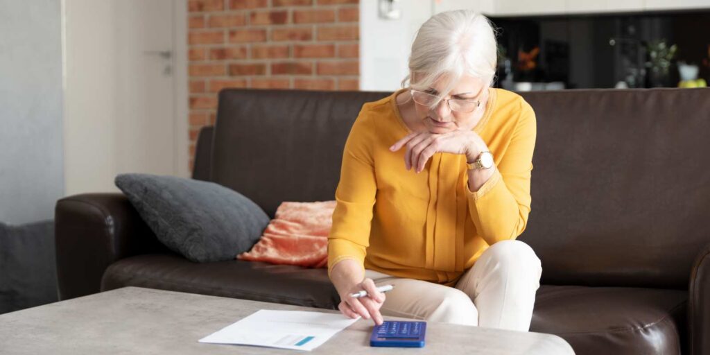 Senior Woman Calculating MYGA Projected Value