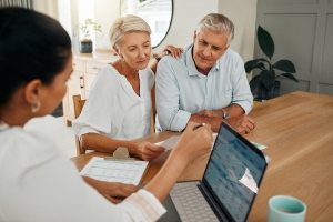 Financial Advisor Explaining MYGA for Social Security to Senior Couple