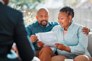 Pre-Retiree Couple Reviewing MYGA Investment Option for Retirement in Financial Advisor Office
