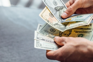 Hands Counting Money Withdrawn from Annuity